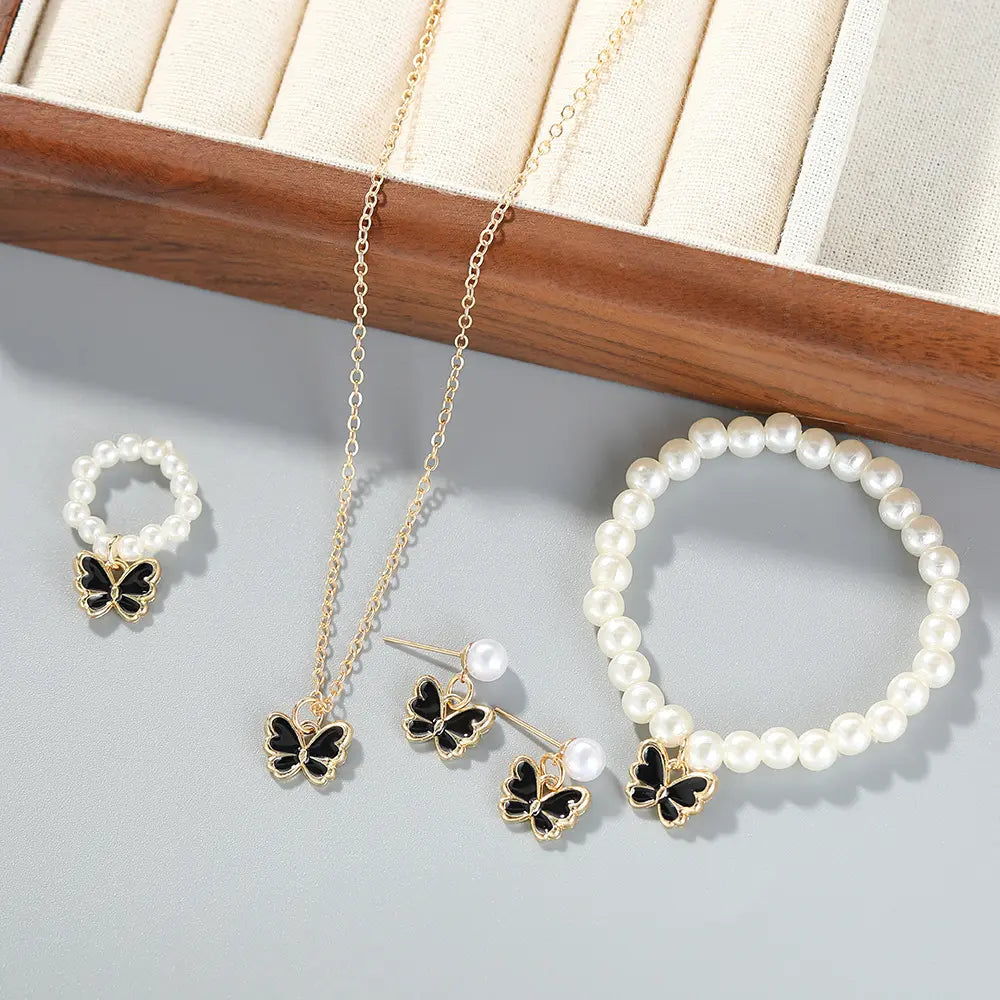 White Pearl & Butterfly Jewelry Set – Necklace, Earrings, Bracelet & Ring